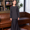 girl standing pose in girl fitted kurung set checked black