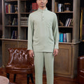 man wearing sage green baju melayu set and posing for the camera