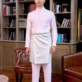 man in baju melayu set soft pink standing pose for the camera