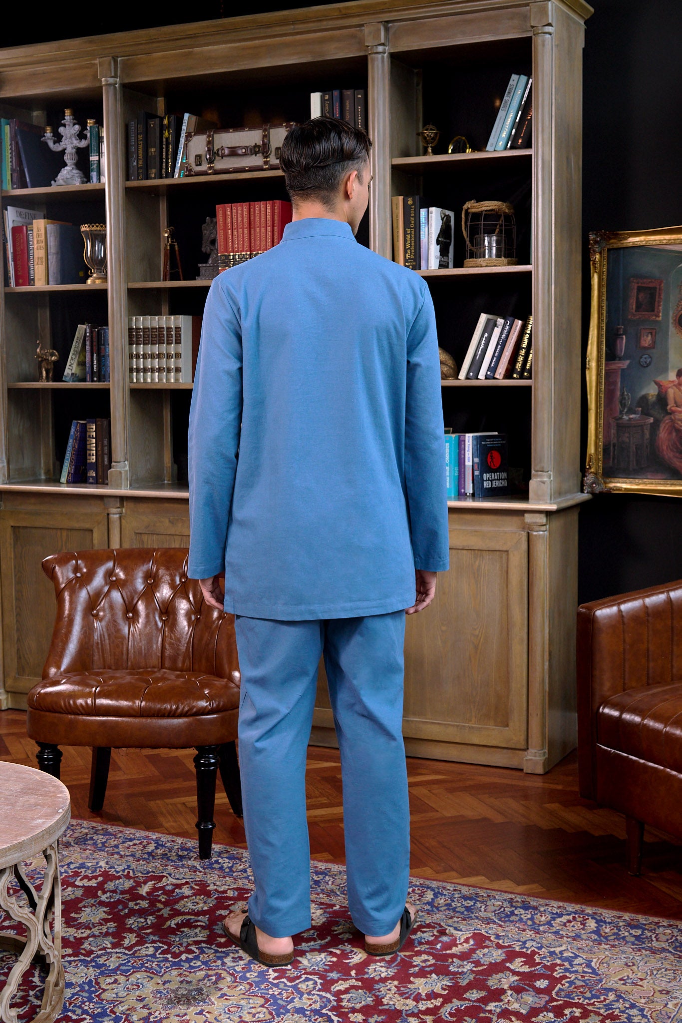back view of men wearing steel blue baju melayu set
