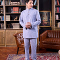 men looking down posing for the camera wearing baju melayu set stone blue