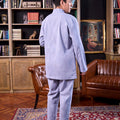 men standing backwards donning stone blue baju melayu set