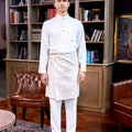 man in baju melayu set white standing pose for the camera
