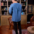 man standing backwards posing in steel blue kurta top