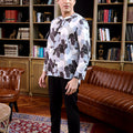 full view of man dressed in bunga raya print teluk belanga top